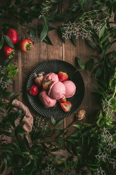 red round fruit on black round plate