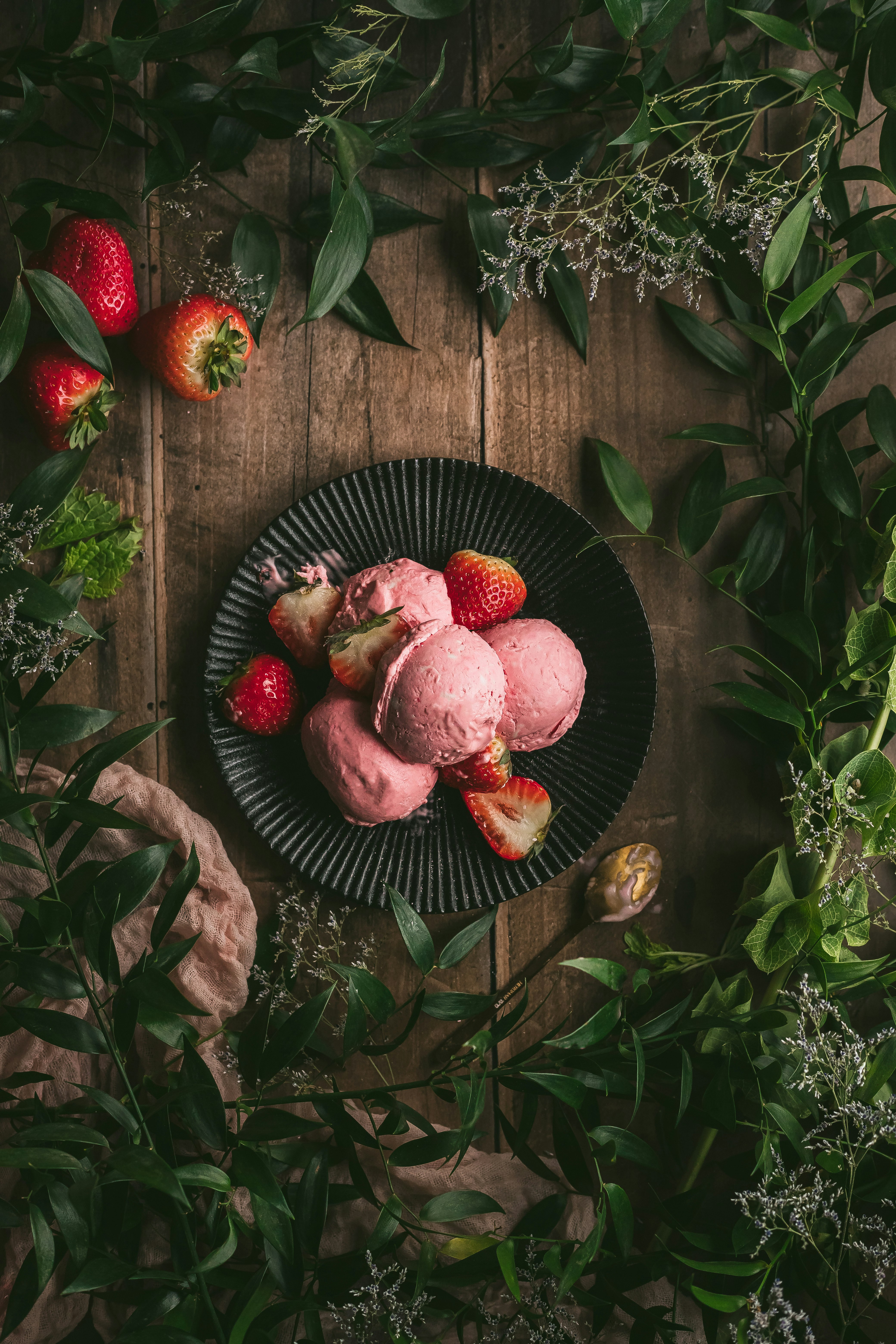 red round fruit on black round plate