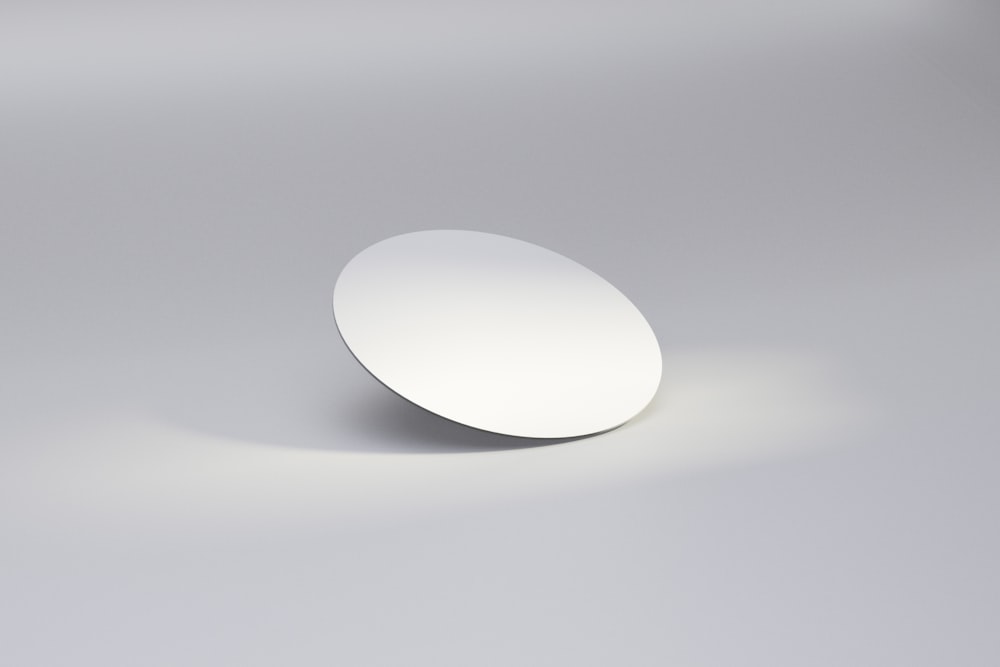 white egg on white surface