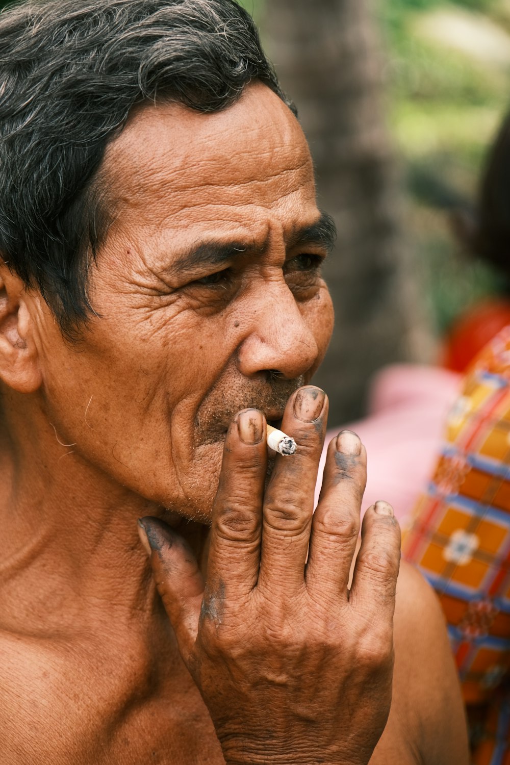 man smoking cigarette during daytime