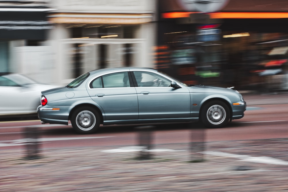 black sedan on road during daytime