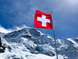 red flag on top of snow covered mountain