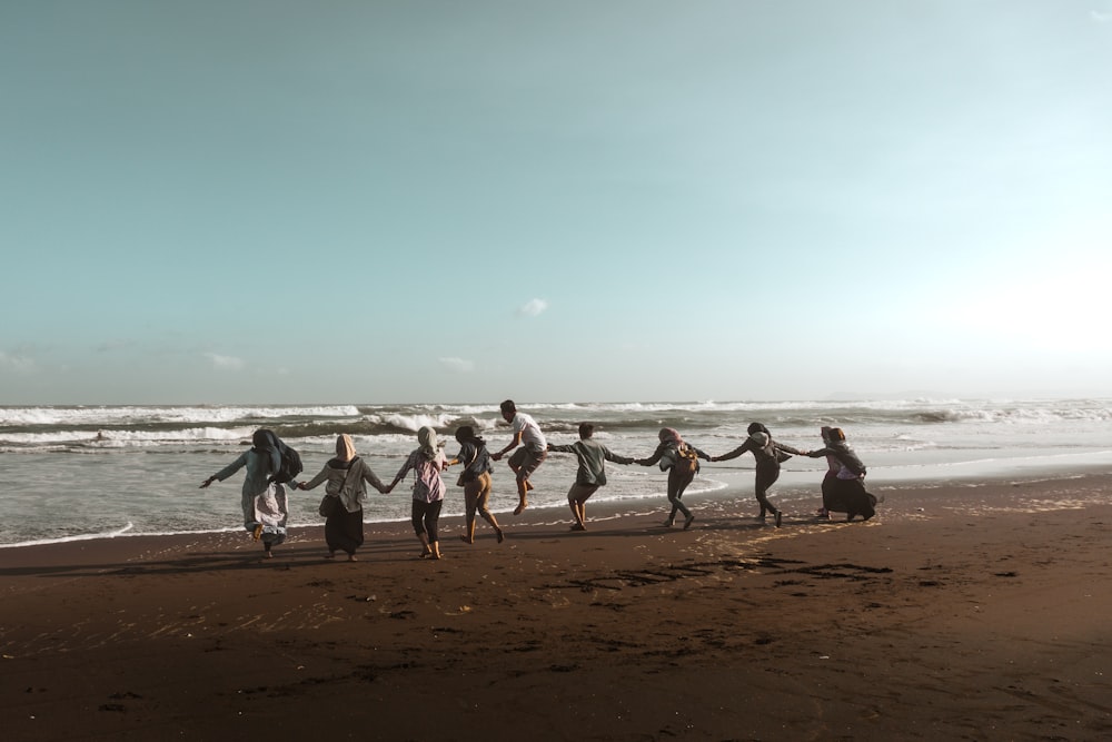 people walking on beach during daytime