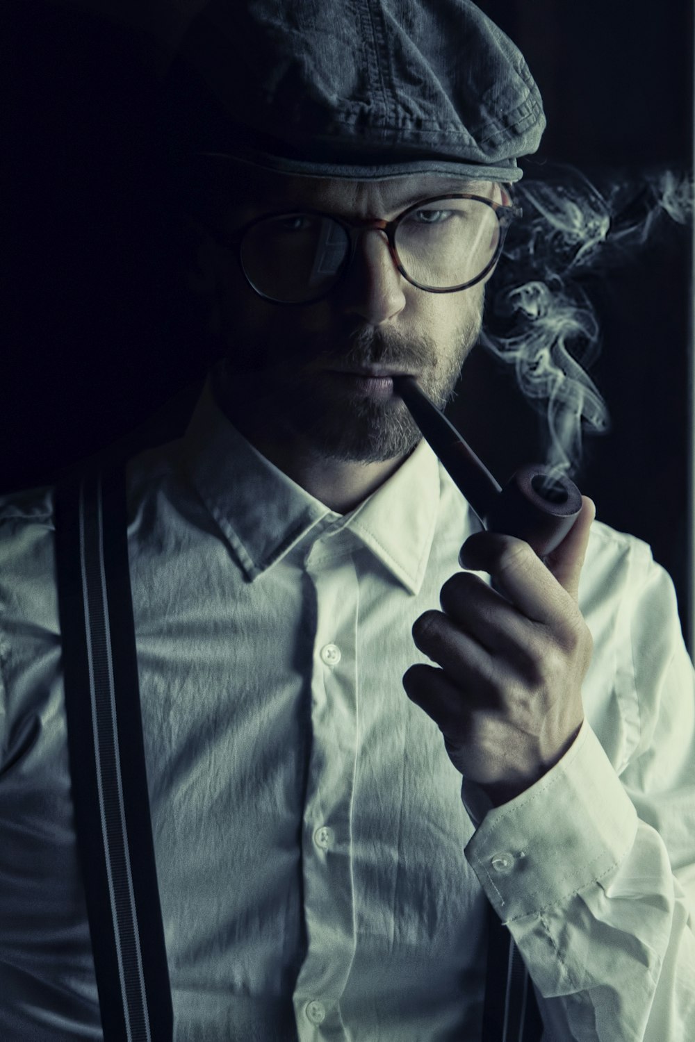 man in white dress shirt smoking