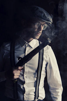 man in white dress shirt wearing black necktie and black sunglasses