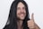 A smiling customer giving a thumbs up to represent satisfaction with blackscope media.