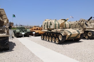 Close-up of various types of tanks: plastic, metal, and concrete, displayed neatly in a warehouse.