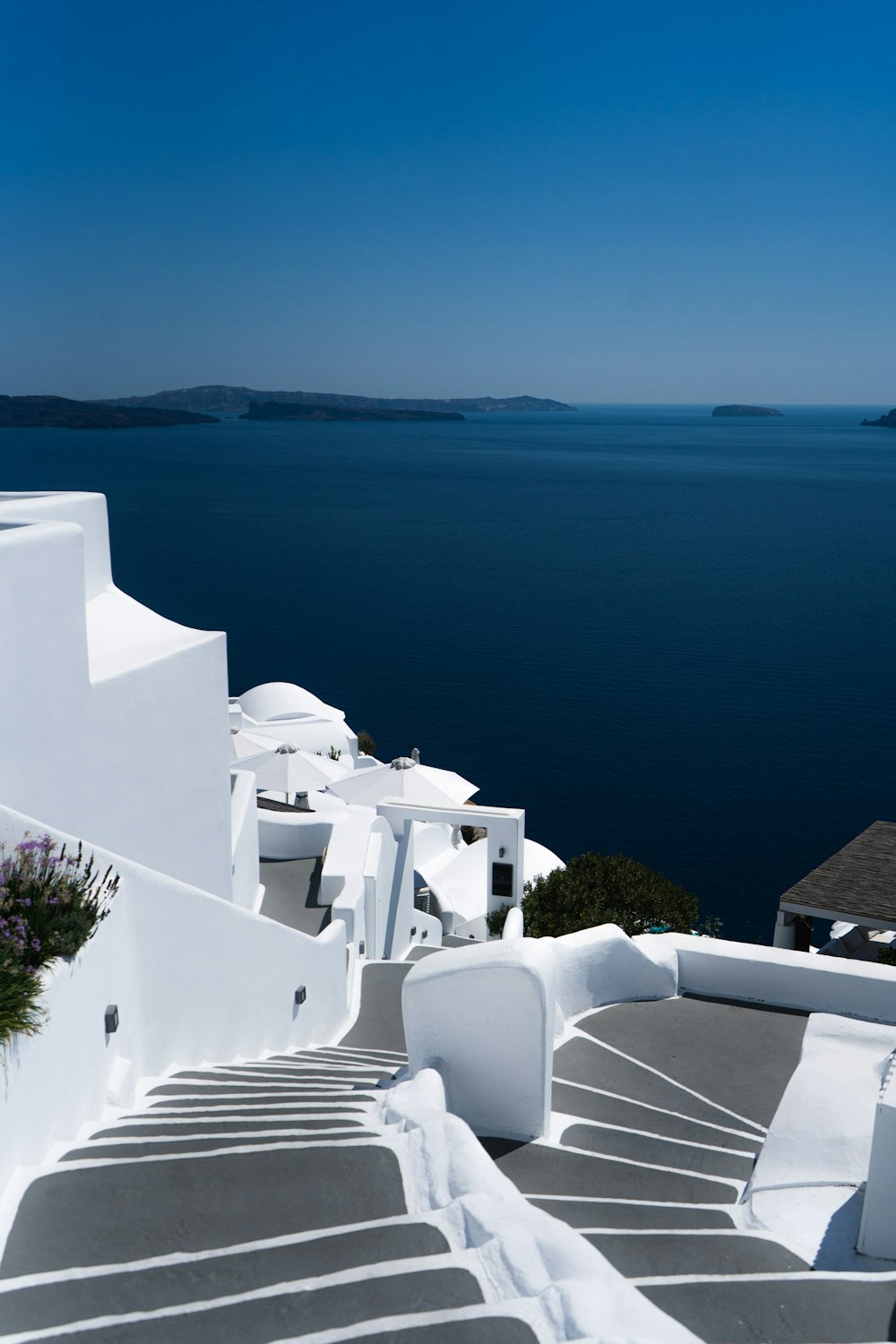 white concrete building near body of water during daytime