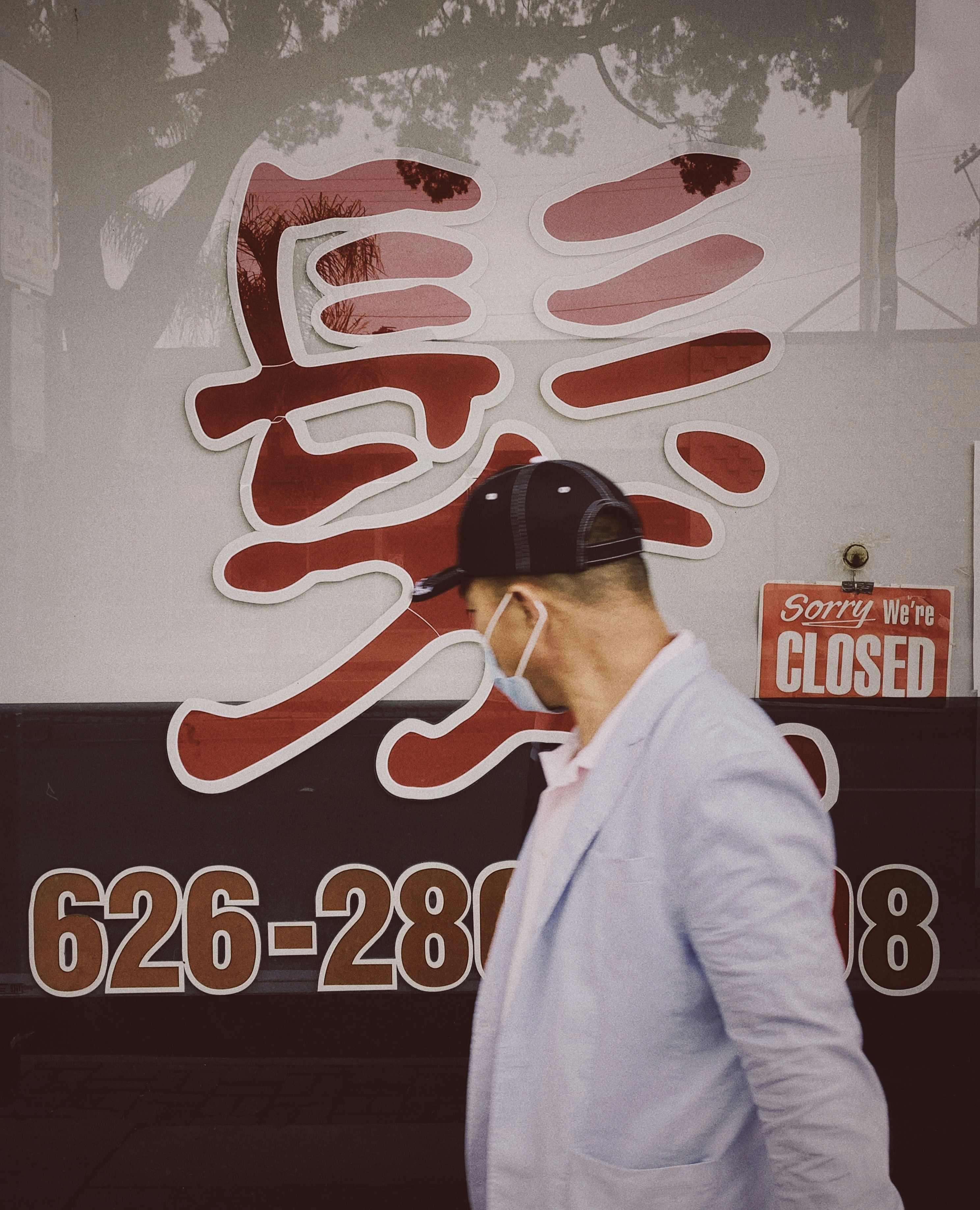 man in white jacket wearing black sunglasses