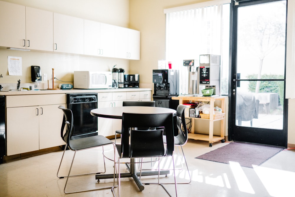 black and white wooden table and chairs