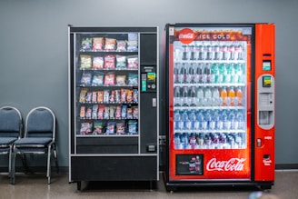 coca cola and coca cola bottles in black vending machine