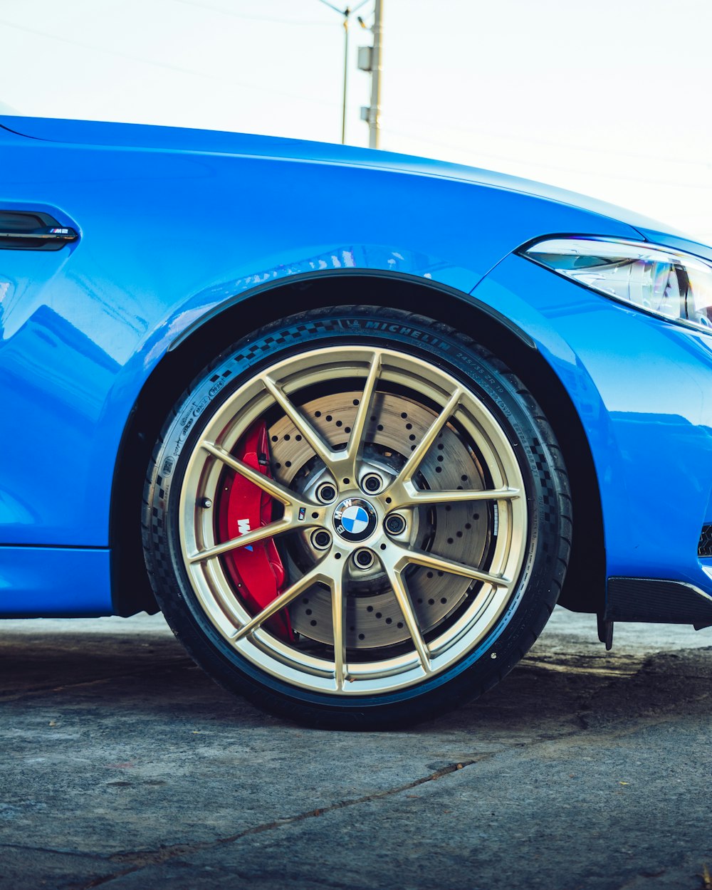 blue car with chrome wheel