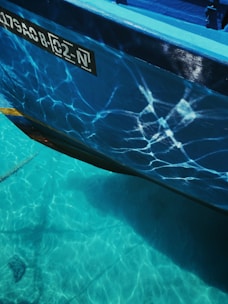 Boat hull shining under natural light during a detailed mobile service.