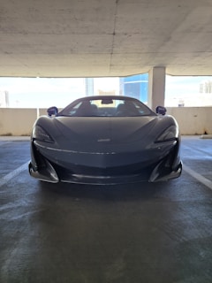 A sleek sports car parked in a modern garage.