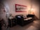 A cozy living room adorned with vibrant seasonal art prints on the walls.