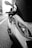 A close-up of a scooter parked on a city street.
