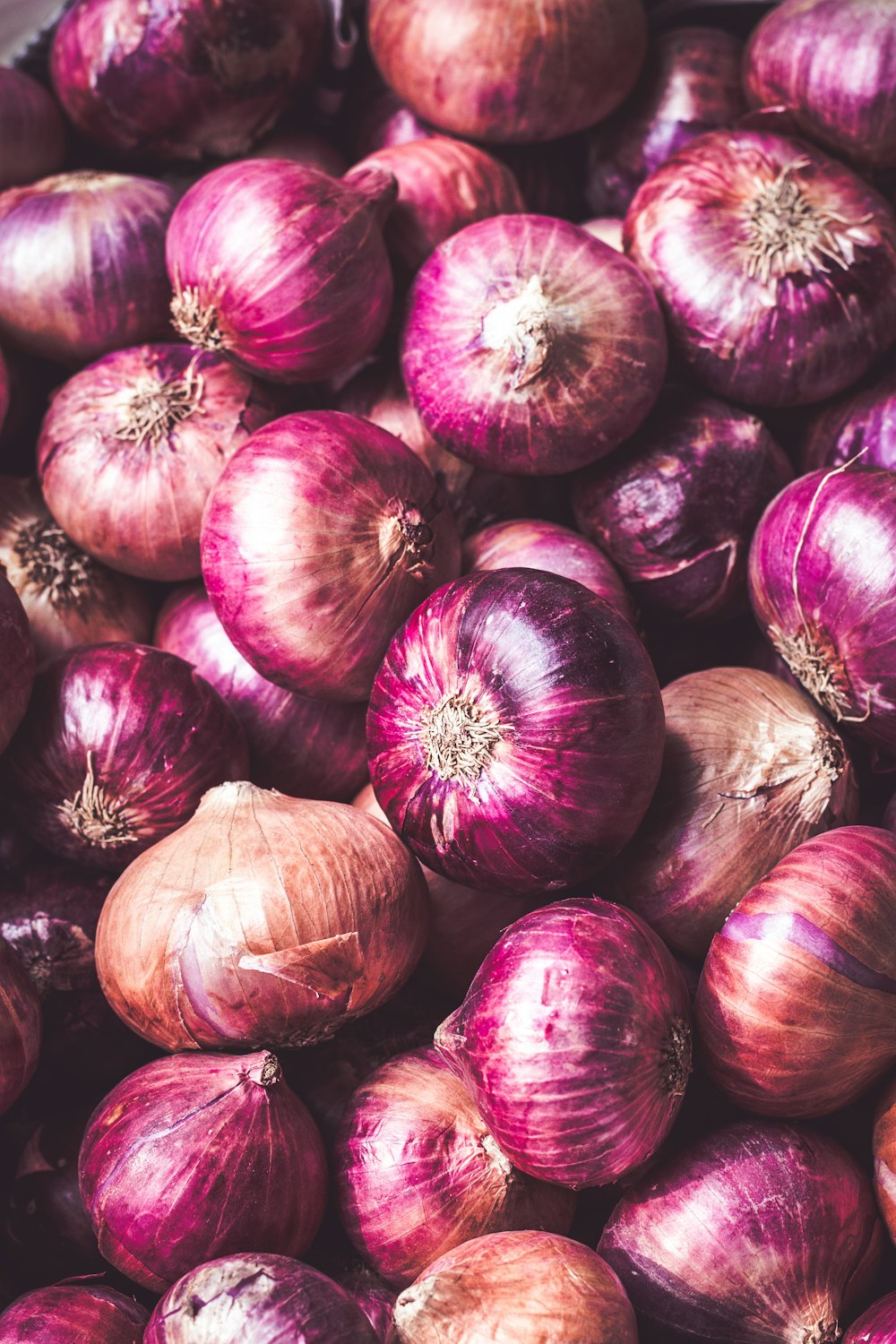 red onion on brown wooden table