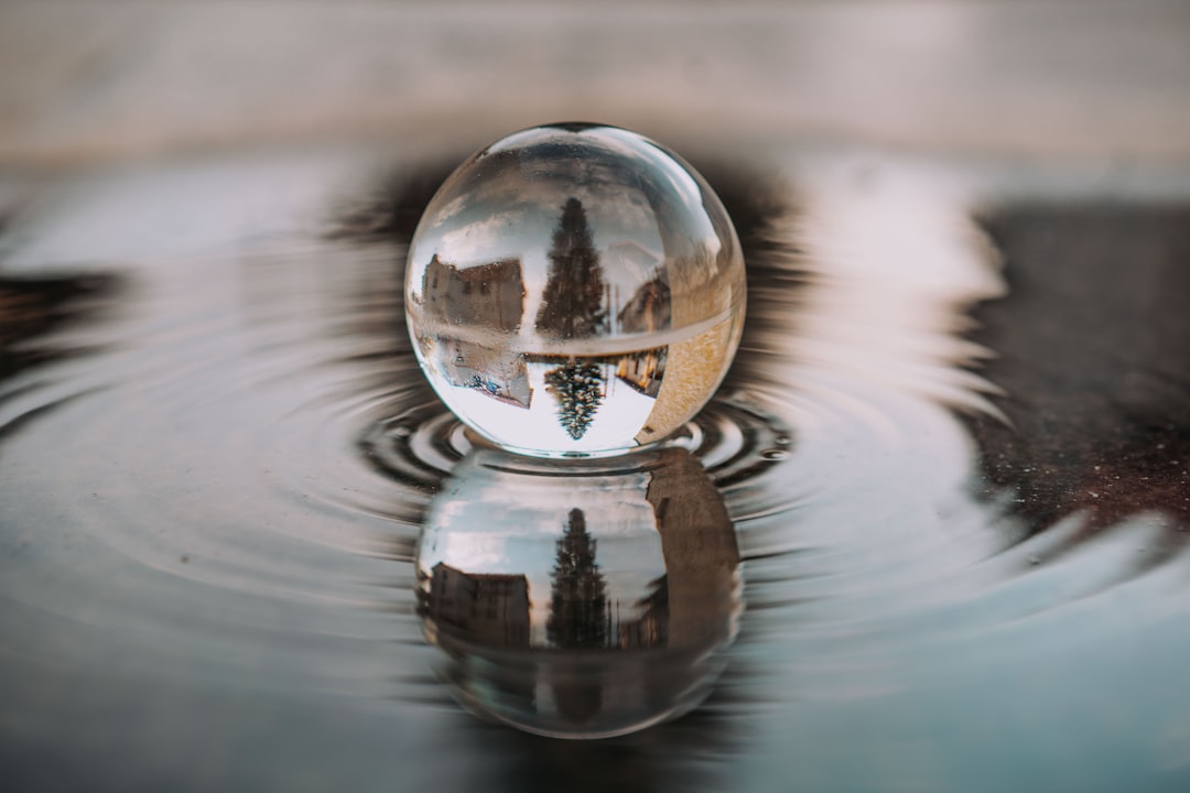 clear glass ball on water