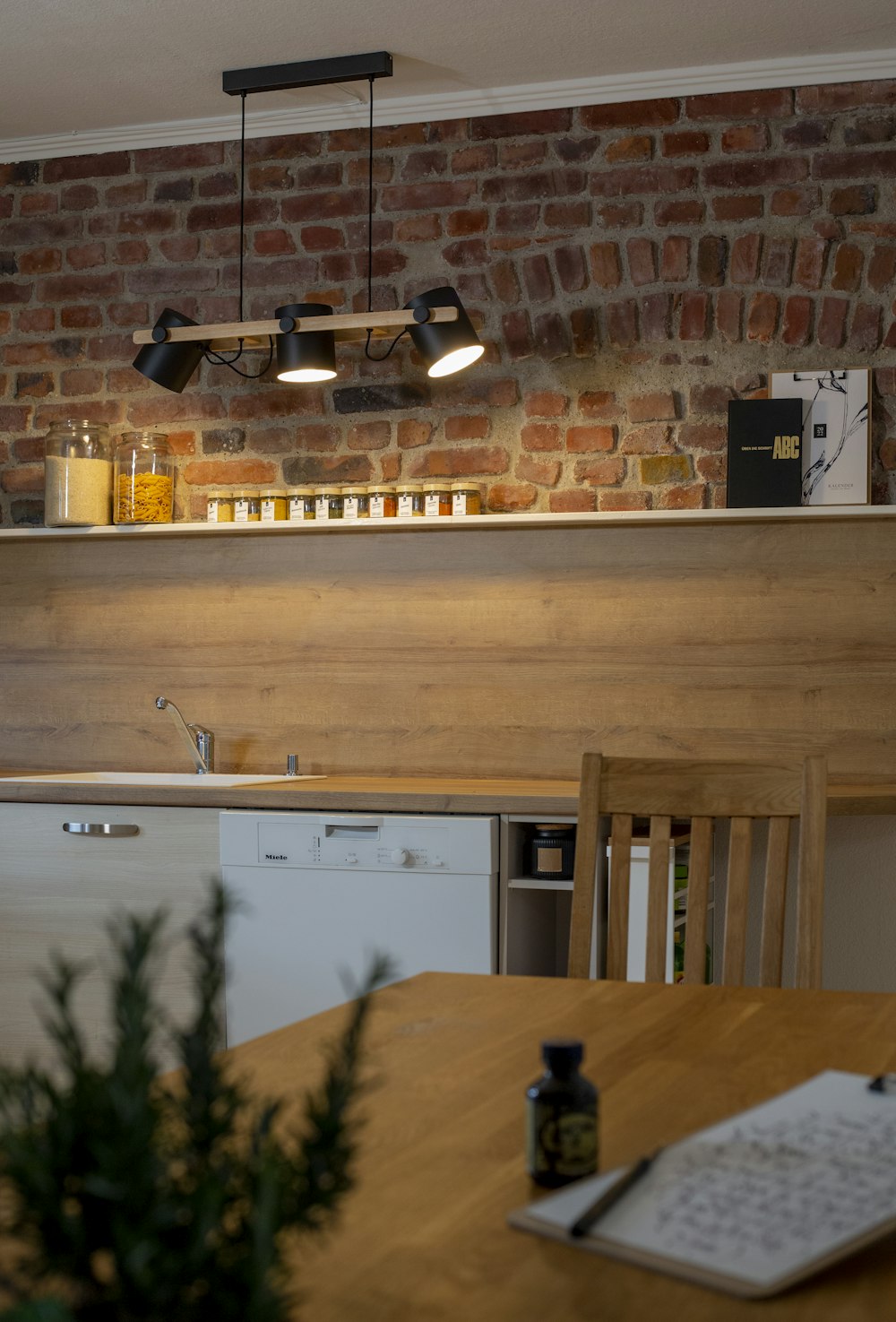 brown wooden table near white wooden cabinet