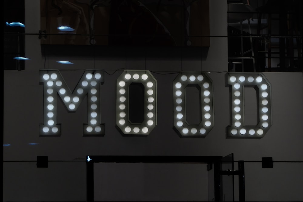 a lighted sign that says mood on it