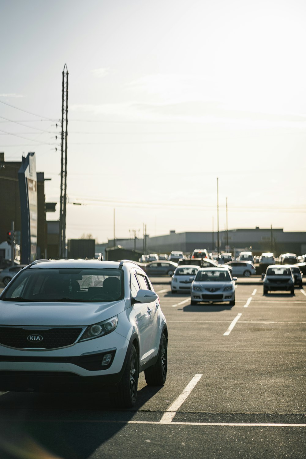 cars parked on parking lot during daytime