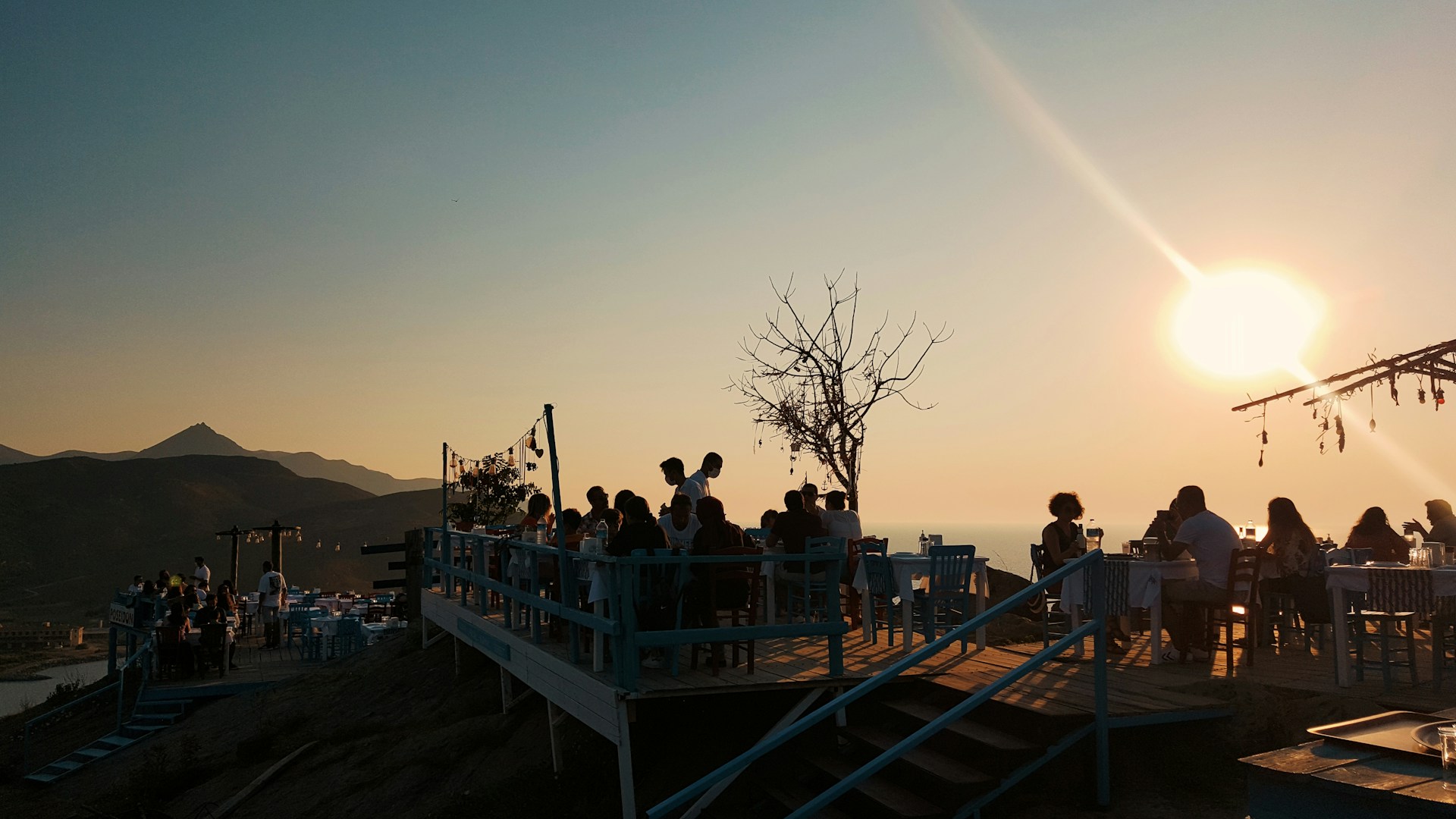 woman wearing yellow long-sleeved dress under white clouds and blue sky during daytime
