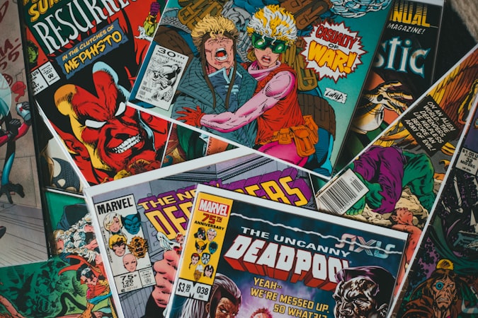 A reader holding a large graphic novel compendium, surrounded by comics
