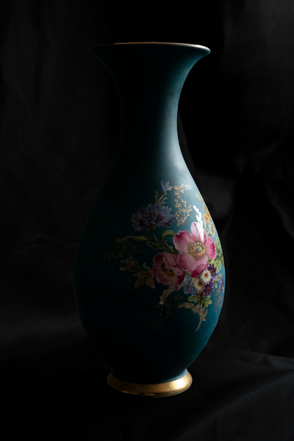 white and pink floral ceramic vase