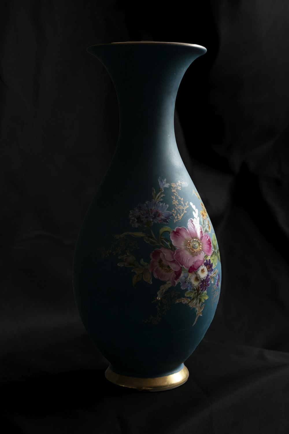 white and pink floral ceramic vase