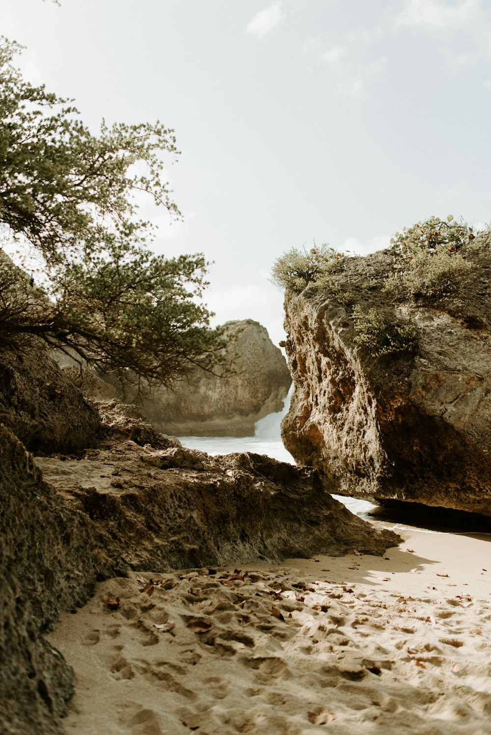 brown rock formation near body of water during daytime