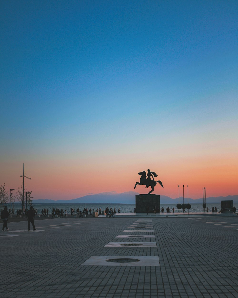 people walking on park during sunset