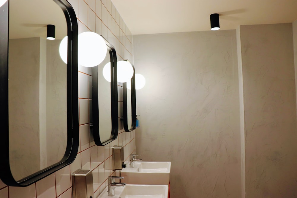 stainless steel shower head on white wall