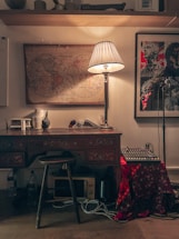 A cozy wooden desk with a vintage microphone and soft jazz album covers nearby.