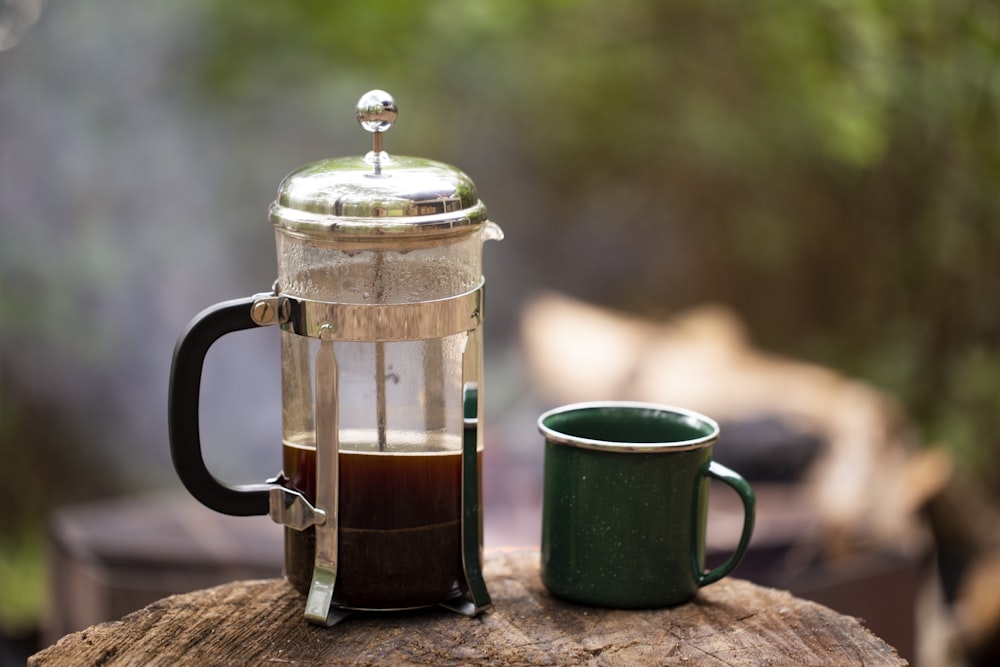 clear glass pitcher with black liquid inside