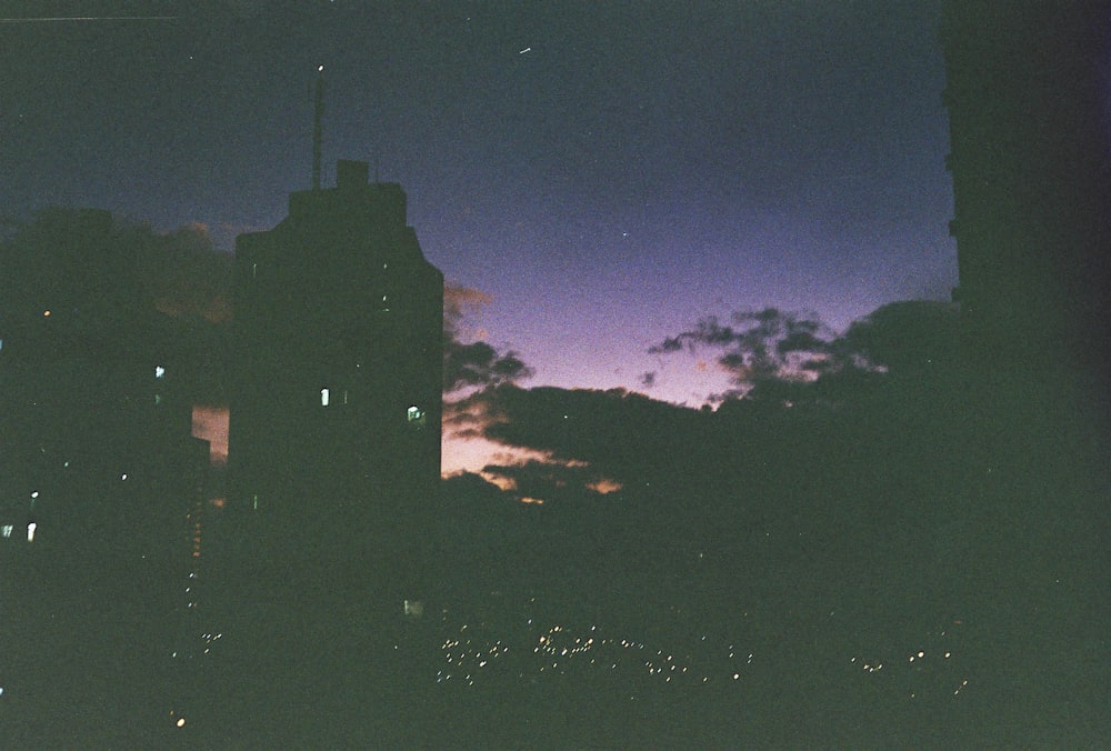 silhouette of building during night time