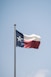 white and red flag on pole during daytime