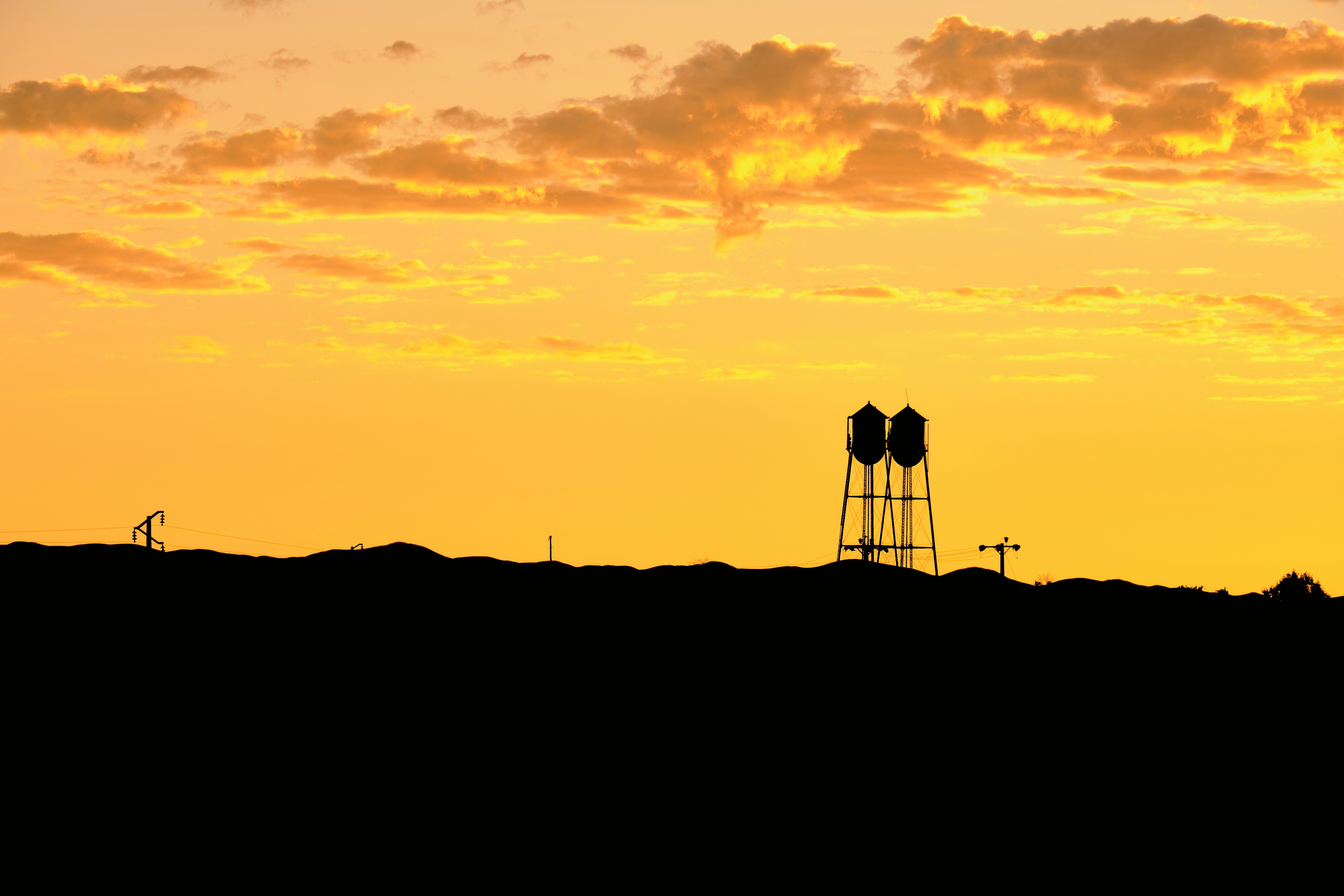 silhouette of people standing on top of mountain during sunset, 