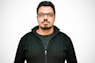 man in black zip up jacket