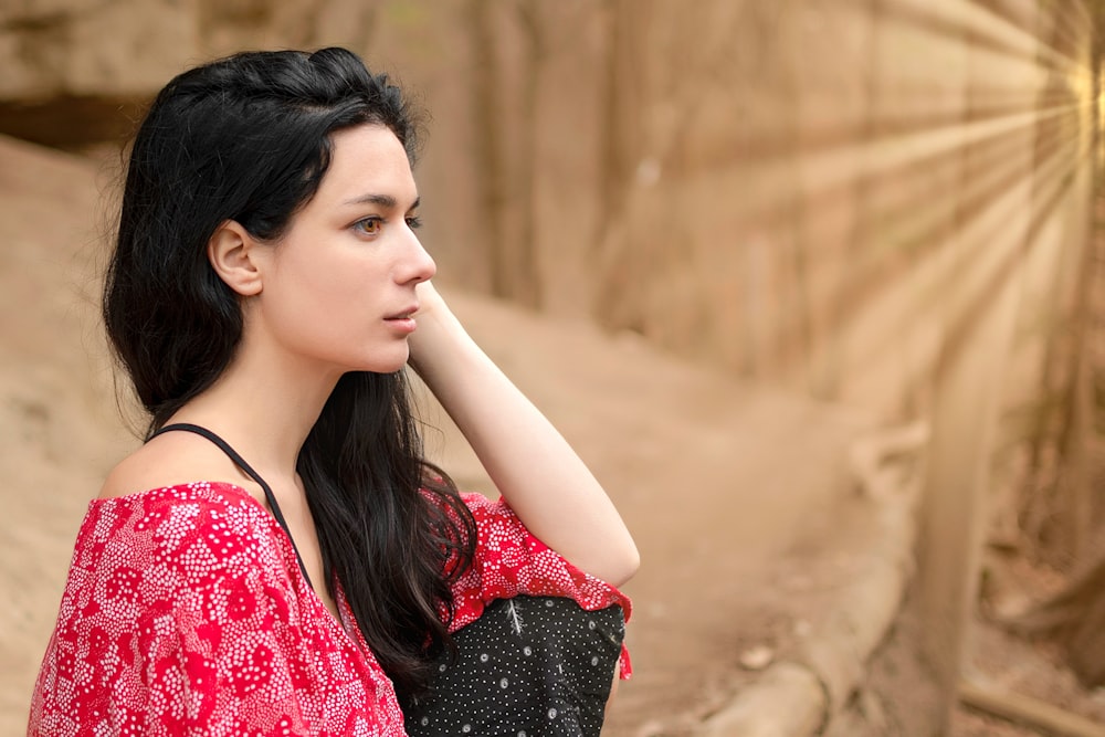 woman in red and black floral dress