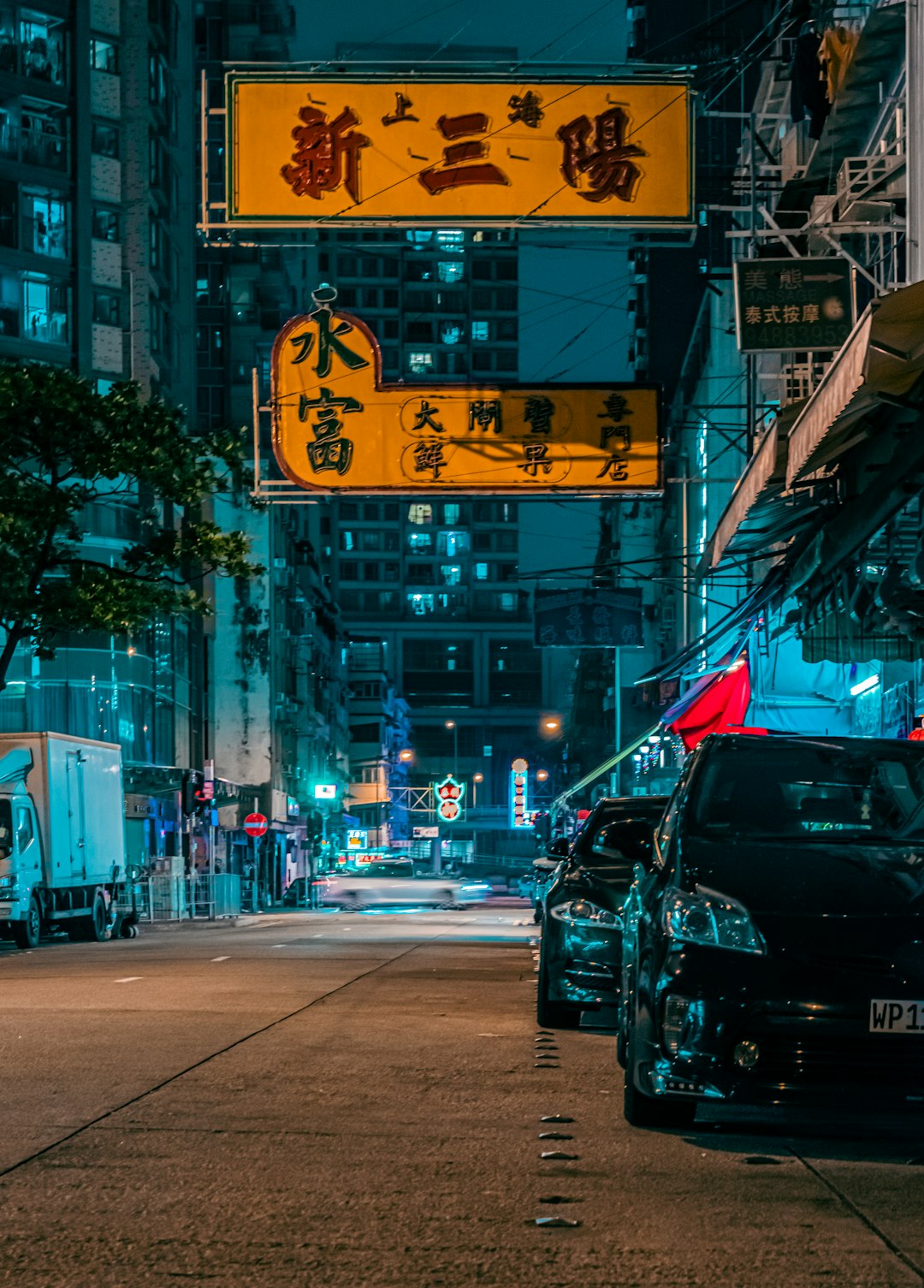 cars on road near buildings during daytime