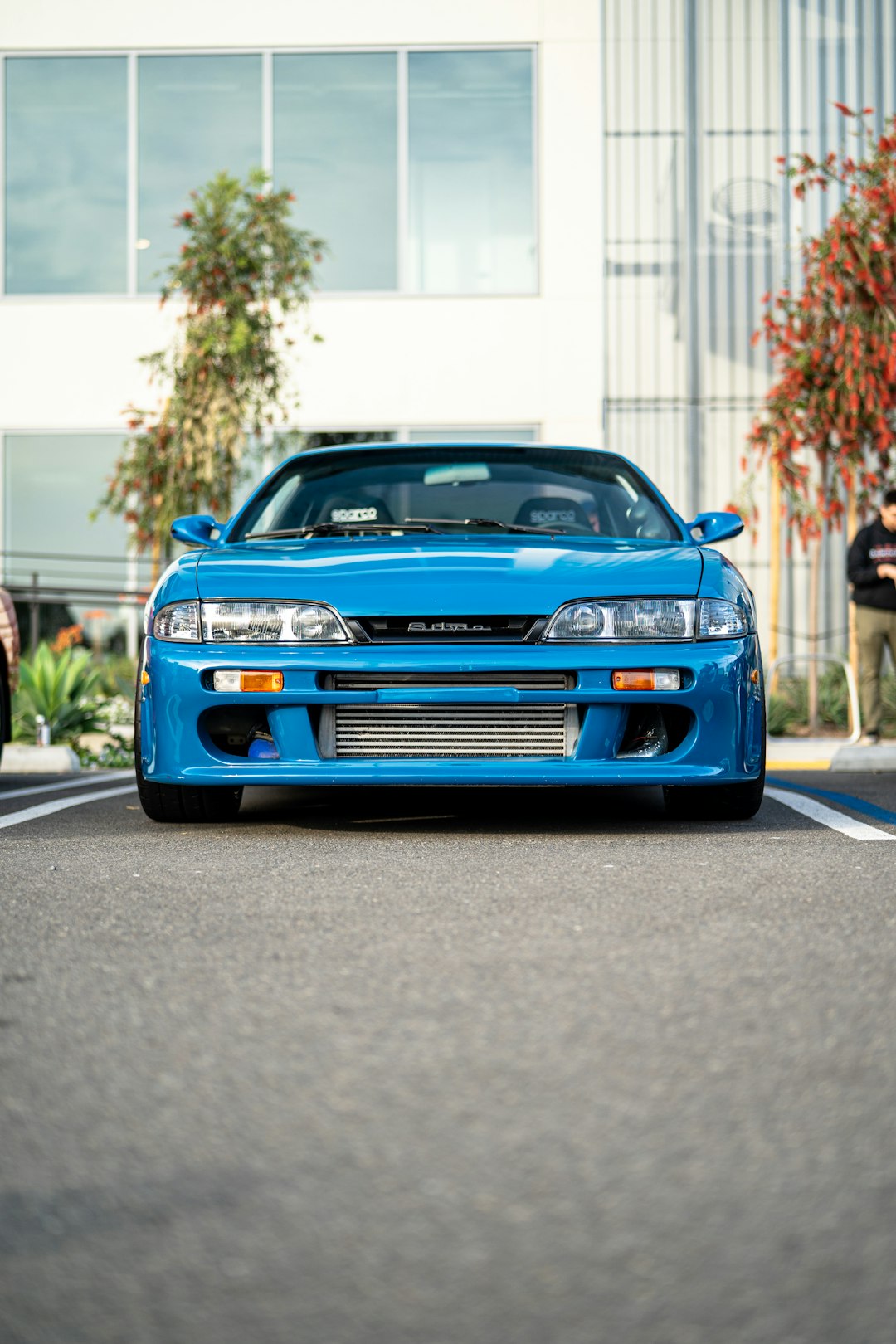 blue chevrolet camaro on road during daytime