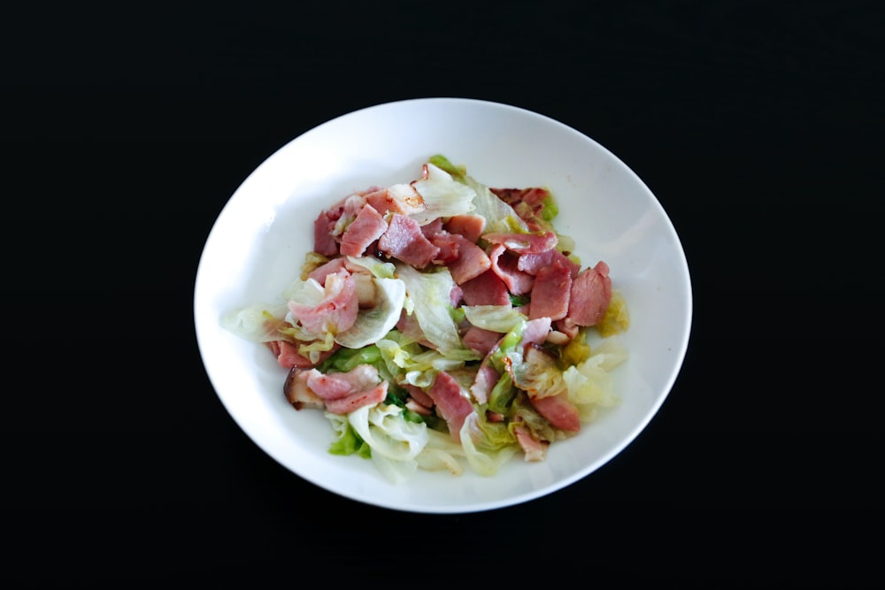 vegetable salad on white ceramic plate