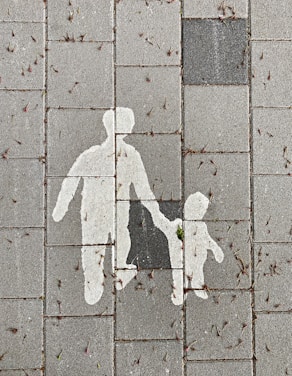 Parent & child walking, symbolizing reconnection & emotional healing after family separation