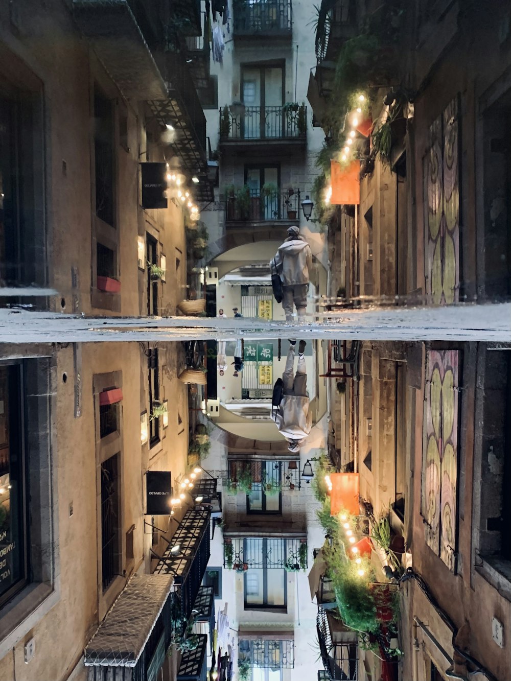 man in black jacket walking on sidewalk during nighttime