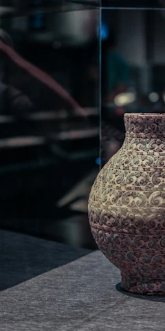 Close-up of an elegant antique vase with intricate patterns.