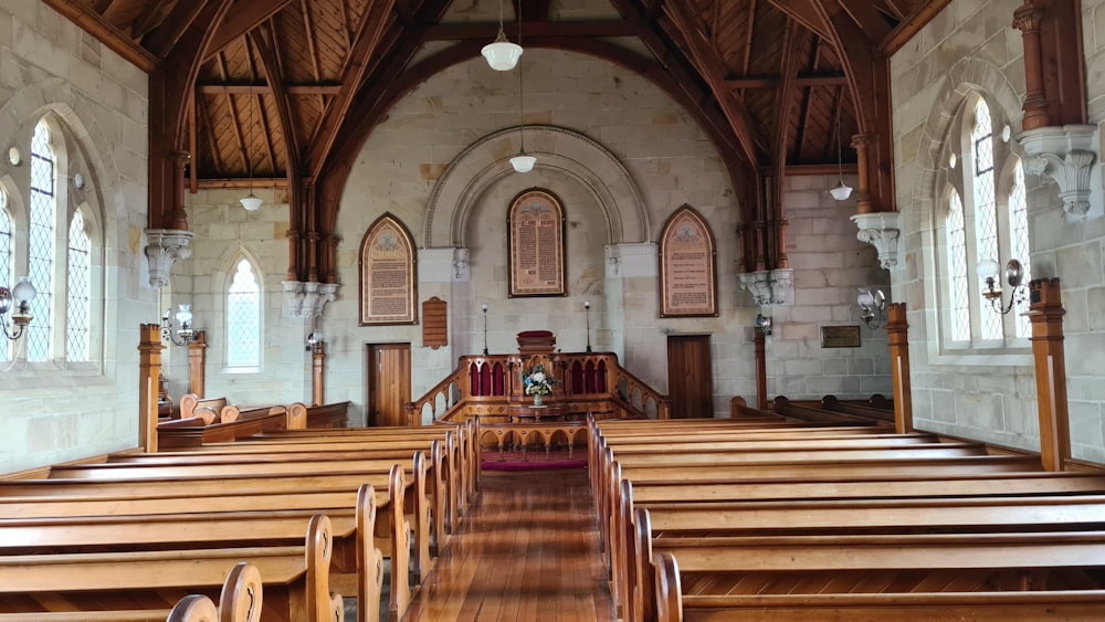 brown wooden chairs inside church