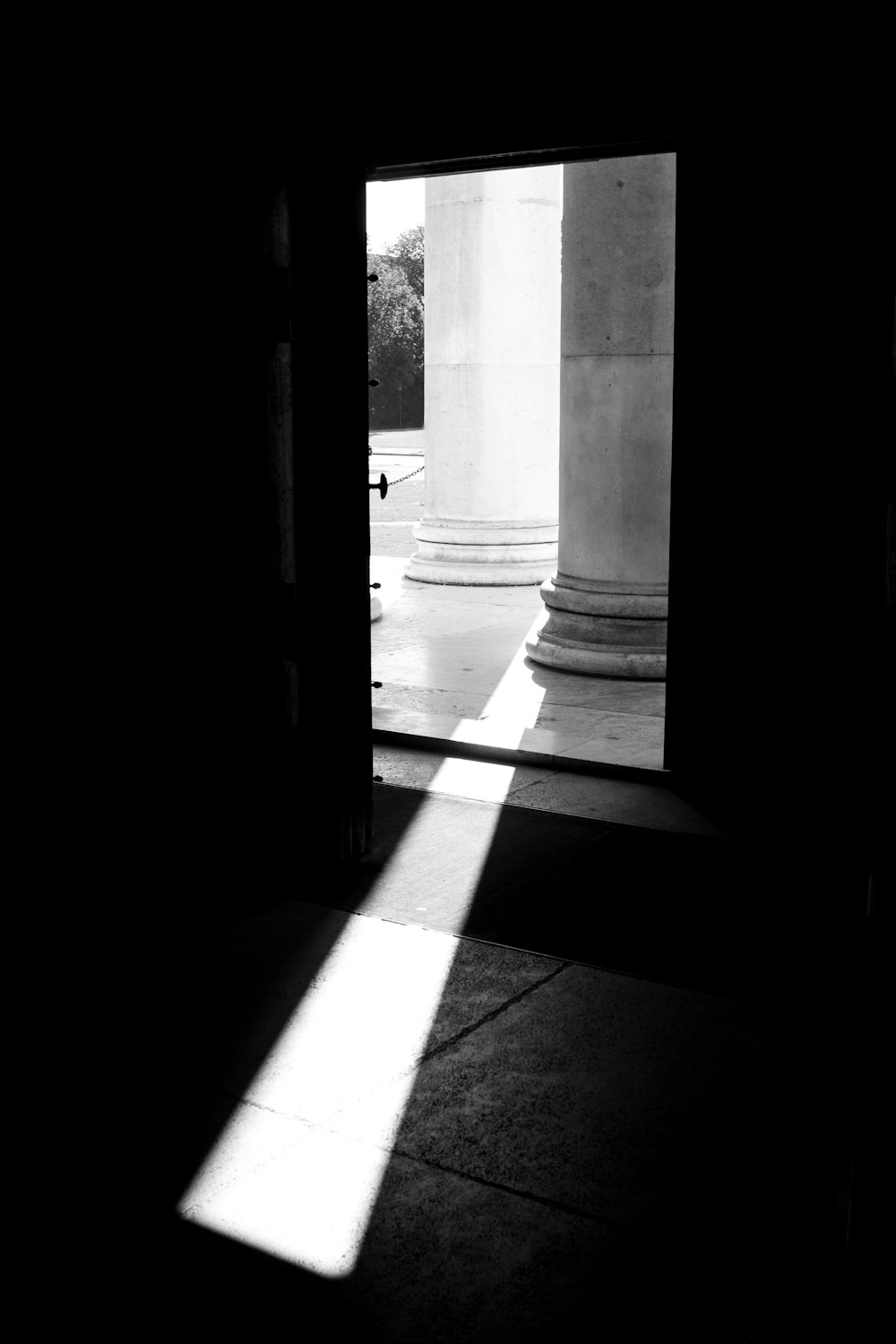 grayscale photo of concrete pillar