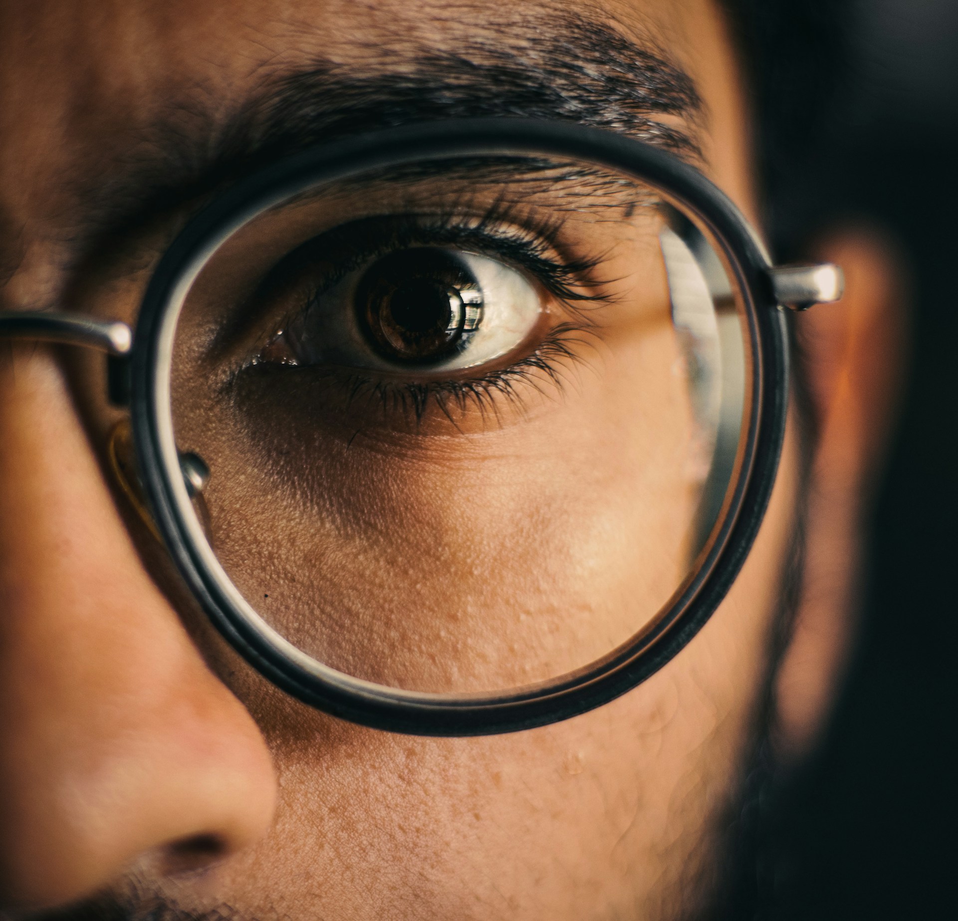 person wearing black framed eyeglasses