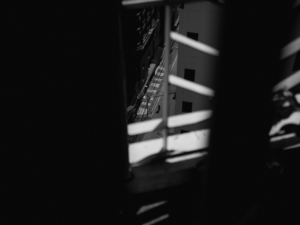 grayscale photo of a ladder