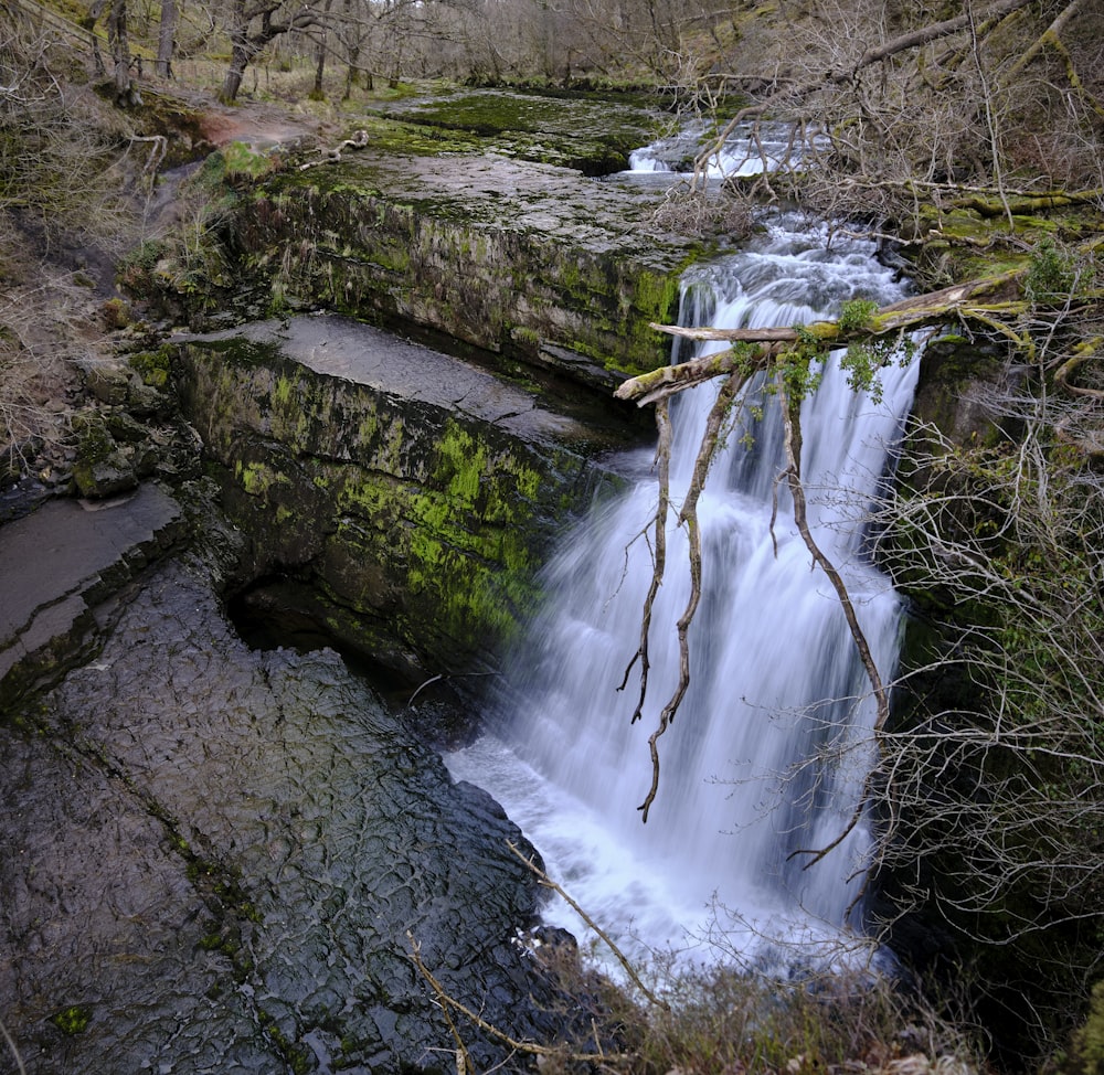 water falls on rocky mountain